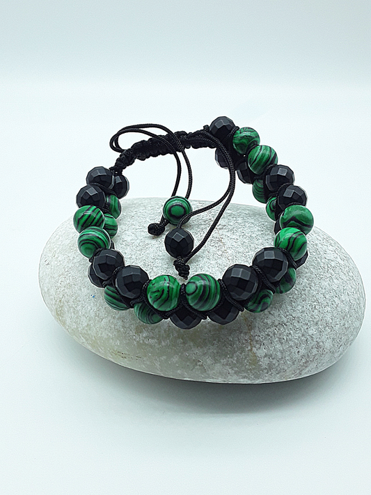 The Emerald Shadow Double Bracelet by Polmadeva – malachite and black onyx double bracelet symbolizing growth, grounding, and balanced strength