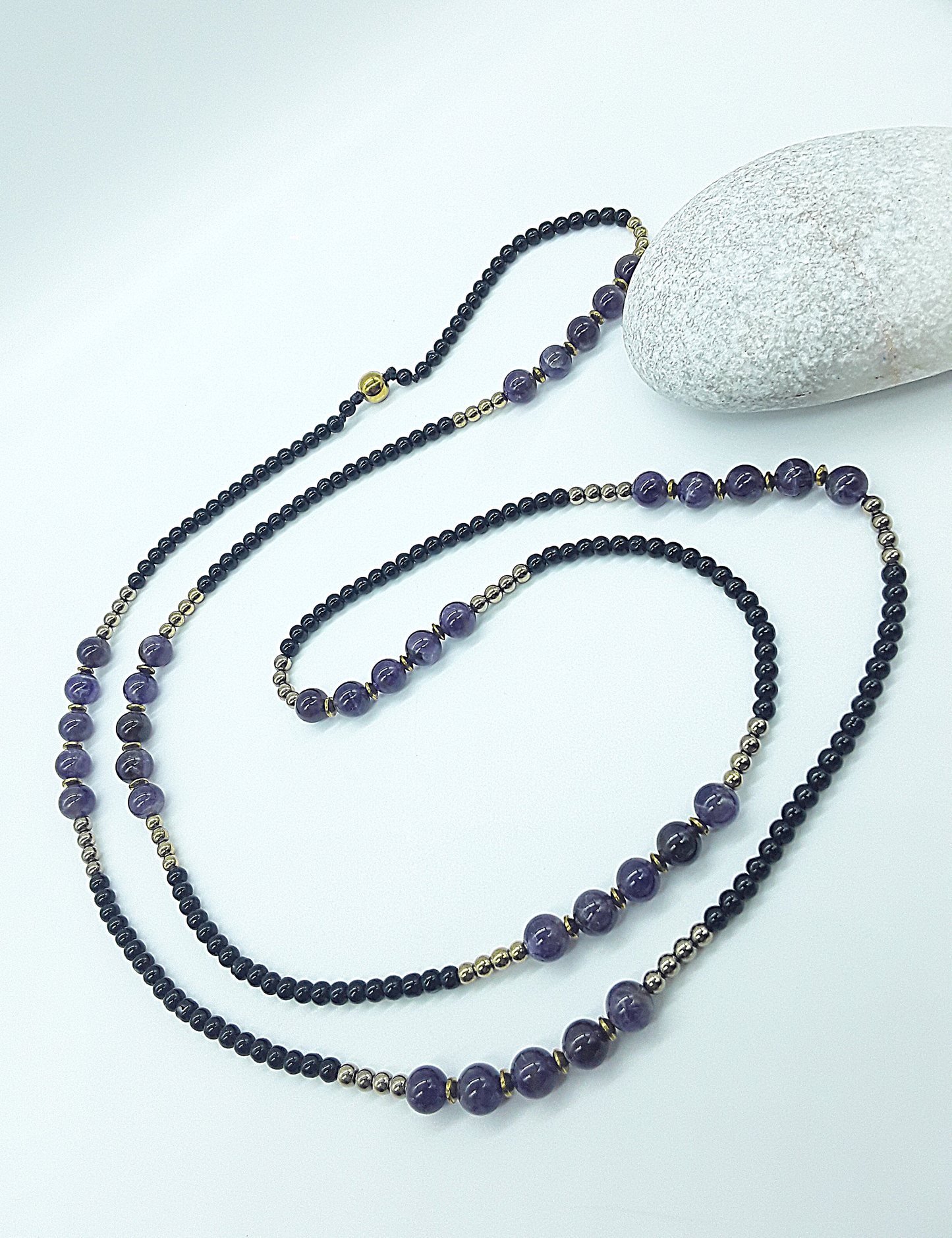 The Graceful Flow Necklace by Polmadeva – amethyst, black onyx and hematite necklace symbolizing calm strength, balance, and resilience