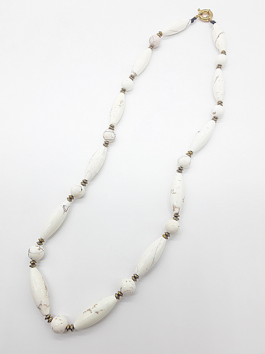 The Ivory Dawn Necklace by Polmadeva – Turquoise and Hematite necklace symbolizing purity, balance, and renewal with gold clasp.