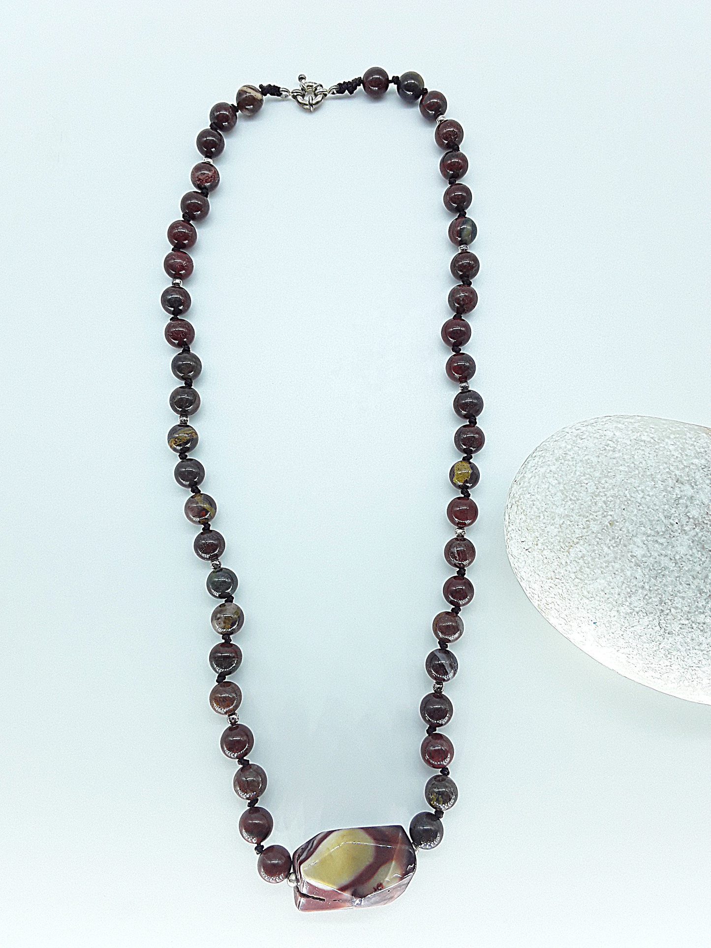The Iron Flame Necklace by Polmadeva – Red Tiger Iron & Agate necklace symbolizing strength, resilience, and balance born in fire.