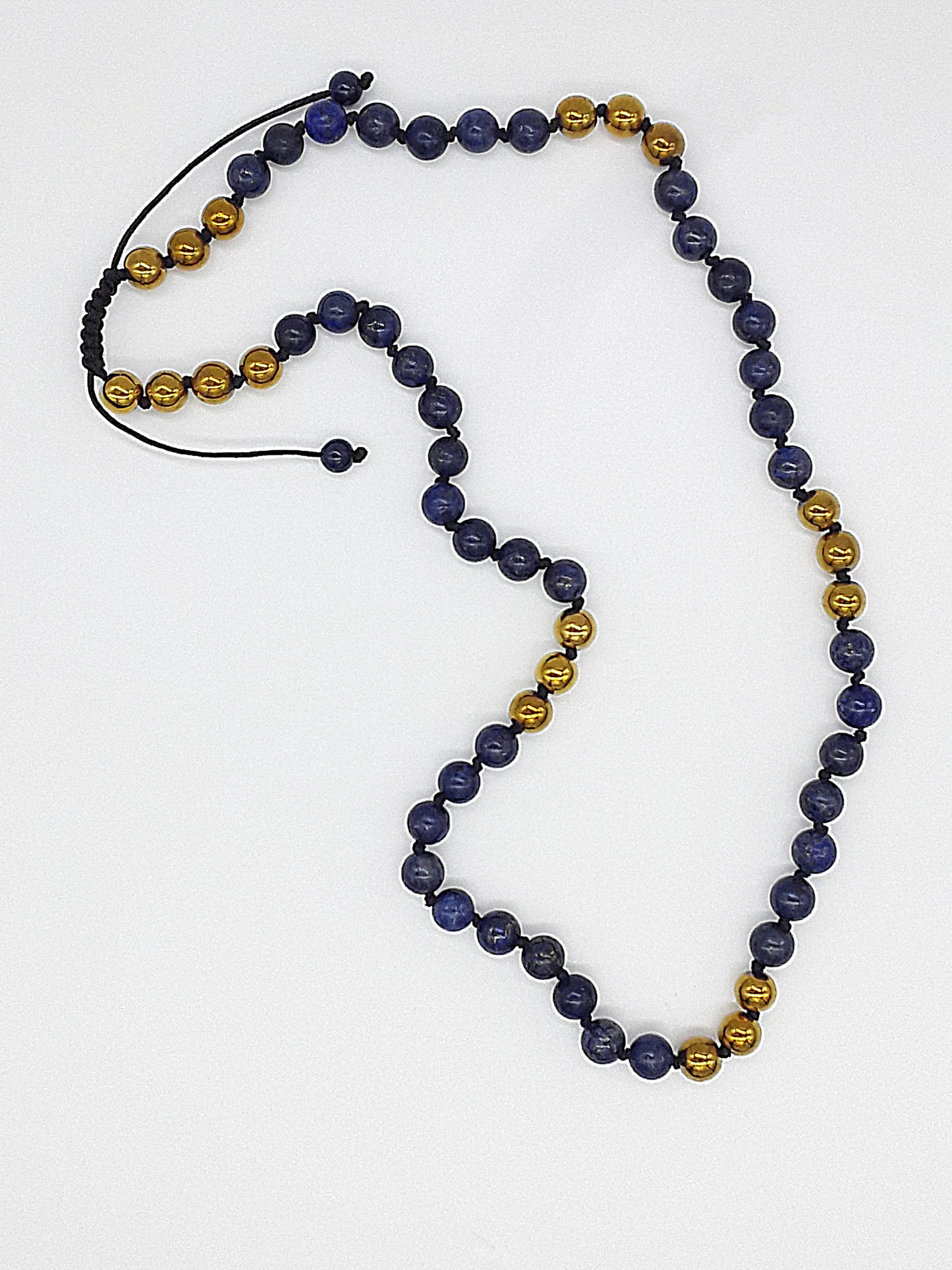 The Sacred Knots Necklace by Polmadeva – handcrafted Lapis Lazuli & Hematite necklace (8 mm), adjustable 60–80 cm. A talisman of vision, clarity & devotion.