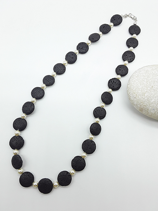 The Eclipse Necklace by Polmadeva – black lava stone and Swarovski pearl necklace with 925 silver symbolizing duality, strength, and elegance