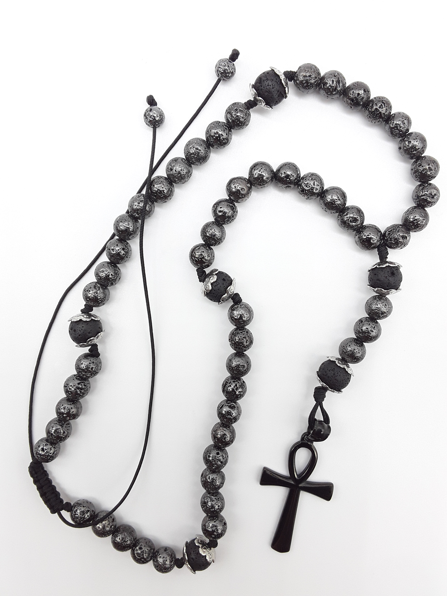 Held in Continuity — Galvanized Lava & Silver Ankh Catholic Rosary (5 Decade) by Polmadeva with black stainless steel Ankh cross on white background.
