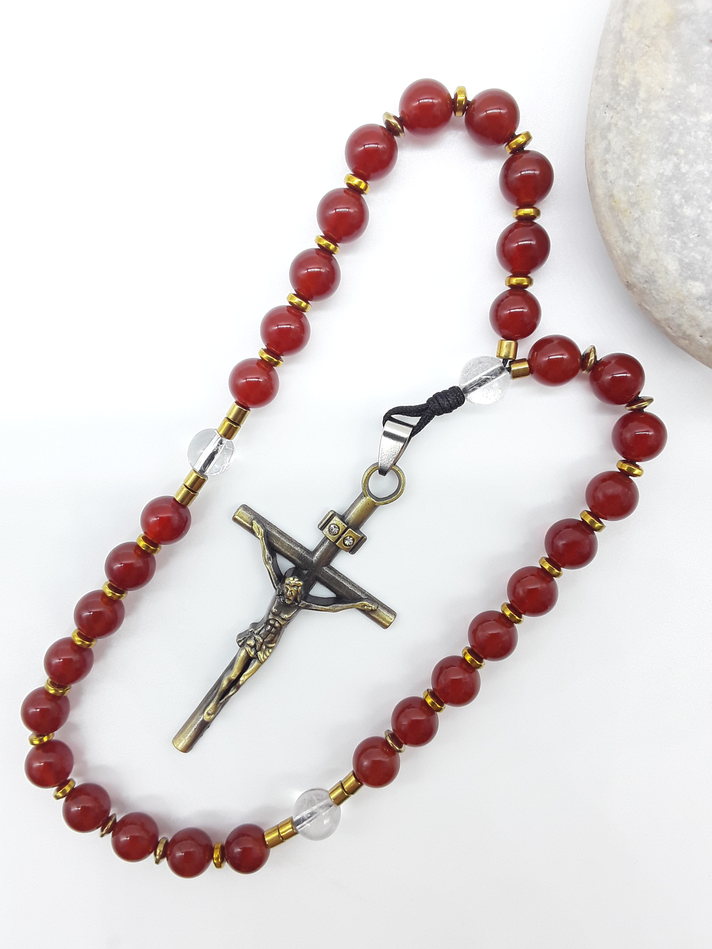 Carnelian Orthodox Rosary with crystal and hematite accents displayed beside natural stone, Polmadeva