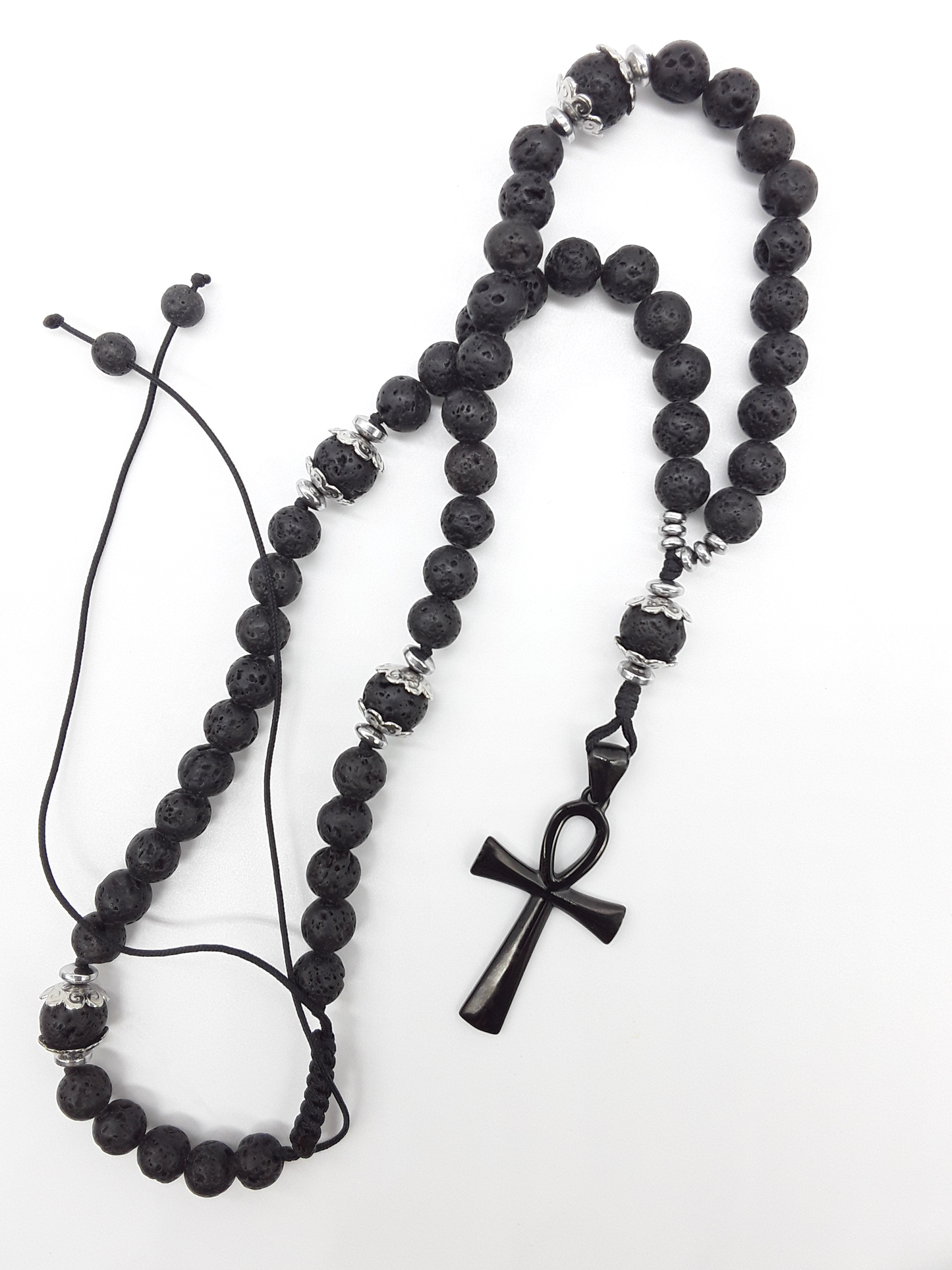 Lava and steel Orthodox Rosary with black stainless steel Ankh cross and adjustable cord by Polmadeva on white background.