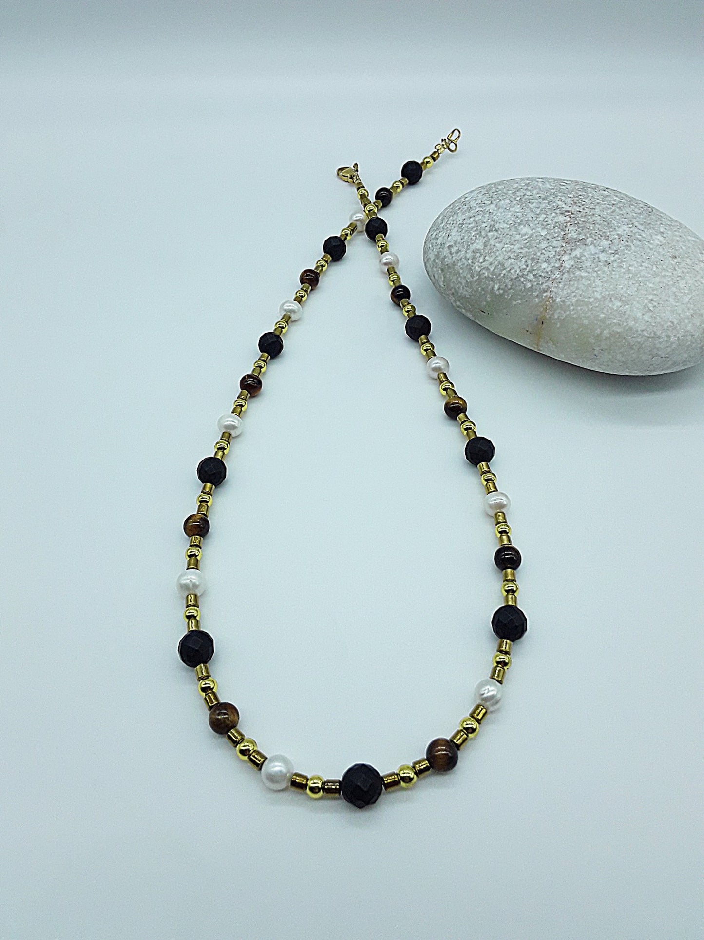 The Guardian Pearl Necklace by Polmadeva – pearl, onyx, tiger’s eye and hematite necklace symbolizing serenity, grounding, and protection