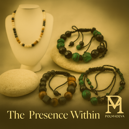 Handcrafted Polmadeva jewelry in warm amber light — necklaces and bracelets that embody presence, beauty, and stillness.