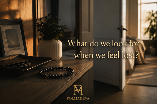 A warm morning interior with natural light, showing a hallway and open door, a side table with a Polmadeva bracelet, and the text “What do we look for when we feel lost?” with the Polmadeva logo.