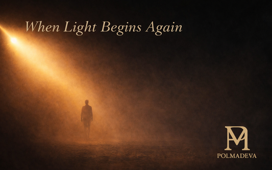 A solitary figure walks through golden mist toward a beam of light. The words “When Light Begins Again” appear above, with the POLMADEVA logo in the lower-right corner.