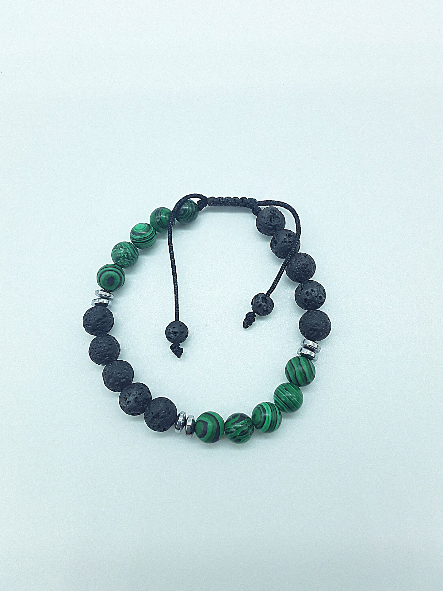 The Guardian Flame Bracelet by Polmadeva – malachite, lava stone and hematite bracelet symbolizing courage, resilience, and fearless growth