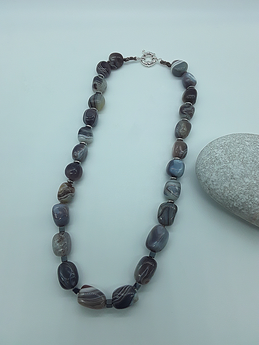 The Earth Horizon Necklace by Polmadeva – Botswana Agate and Hematite necklace inspired by ancient landscapes and grounded harmony.