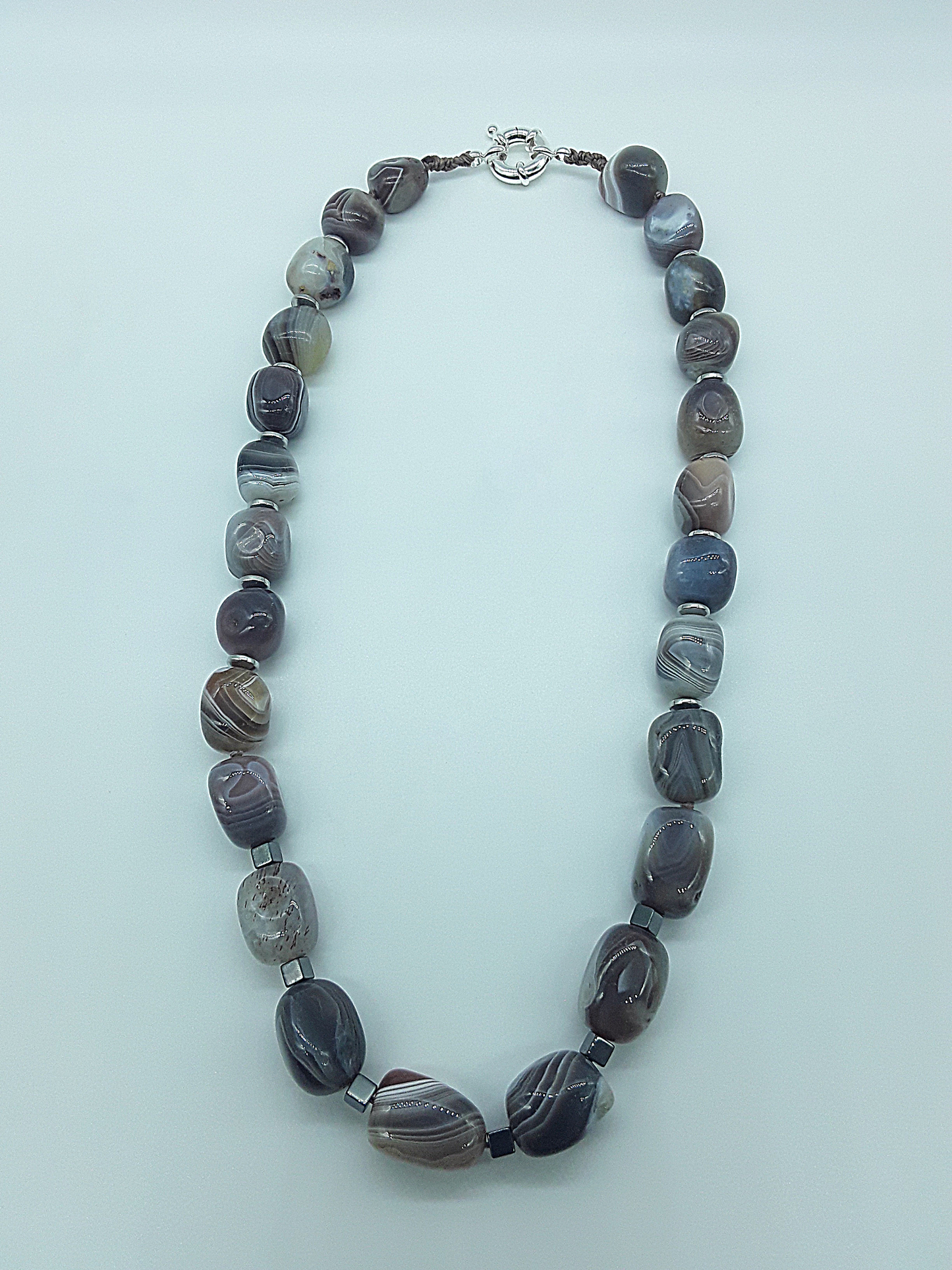 The Earth Horizon Necklace by Polmadeva – Botswana Agate and Hematite necklace inspired by ancient landscapes and grounded harmony.