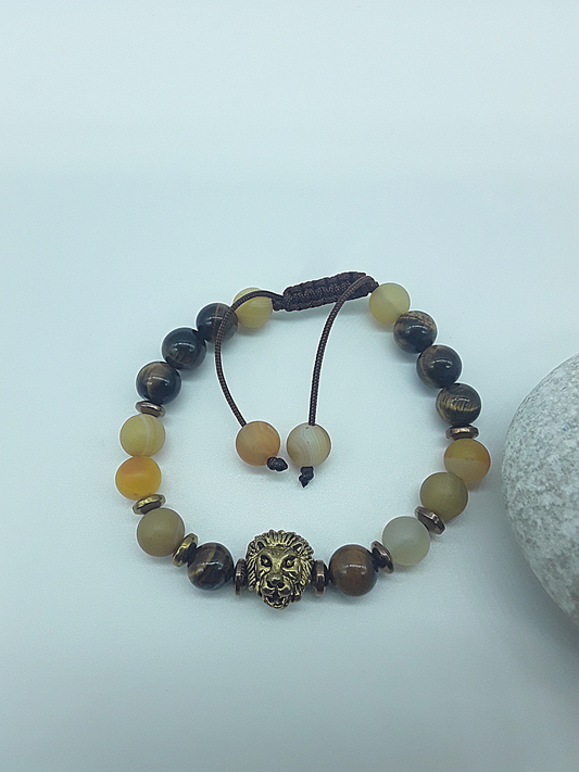 The Lion’s Balance Bracelet by Polmadeva – Tiger’s Eye, Agate & Hematite bracelet with metallic lion charm symbolizing harmony, courage & grounding.