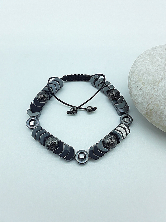 The Ash & Steel Bracelet by Polmadeva – hematite and lava stone bracelet symbolizing resilience, grounding, and rebirth