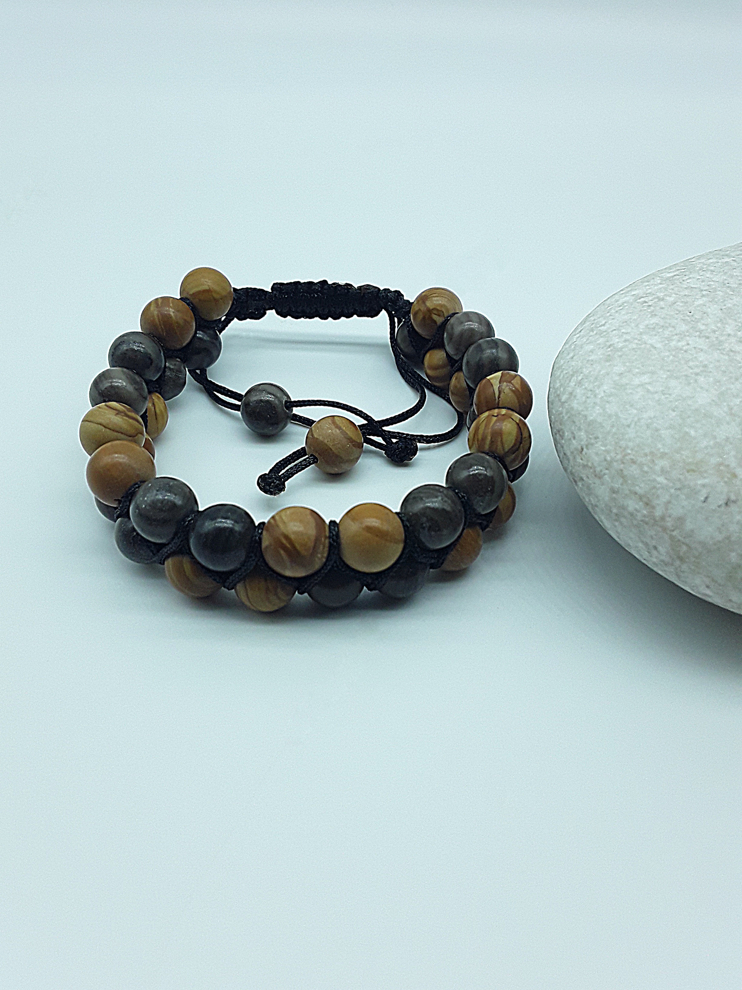 The Earth Harmony Double Bracelet by Polmadeva – Black Wood Lace Stone & Tigerskin Jasper bracelet symbolizing grounding, balance, and harmony.