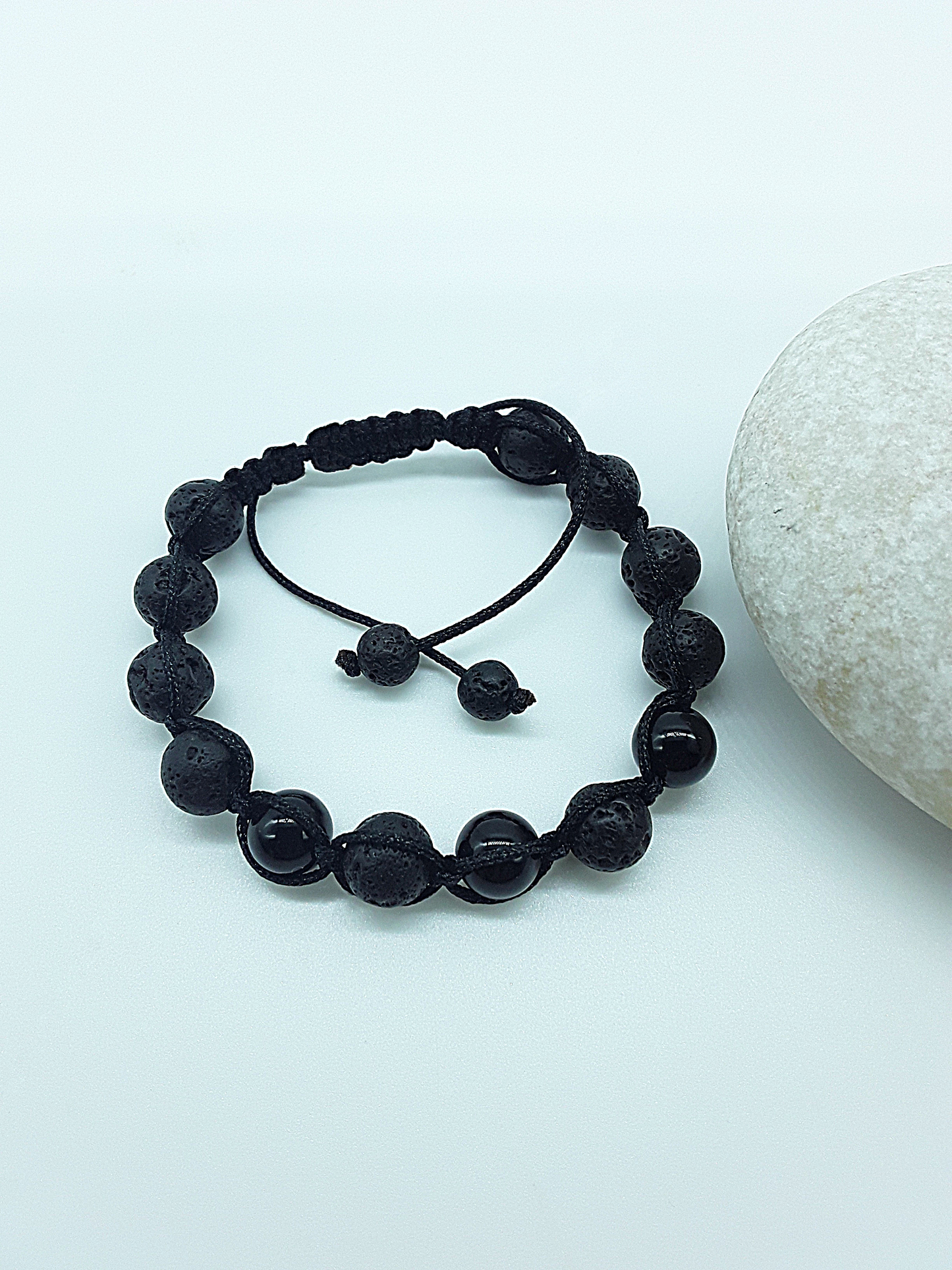 The Phoenix Stone Bracelet by Polmadeva – lava stone and onyx bracelet symbolizing renewal, grounding, and new beginnings