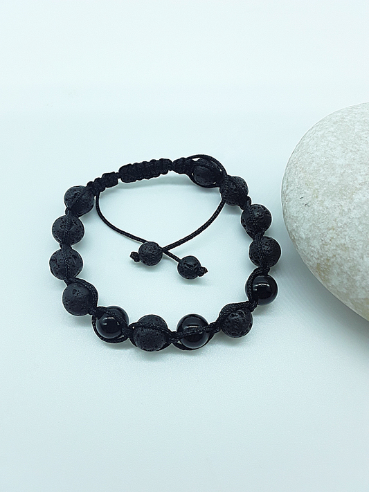 The Phoenix Stone Bracelet by Polmadeva – lava stone and onyx bracelet symbolizing renewal, grounding, and new beginnings