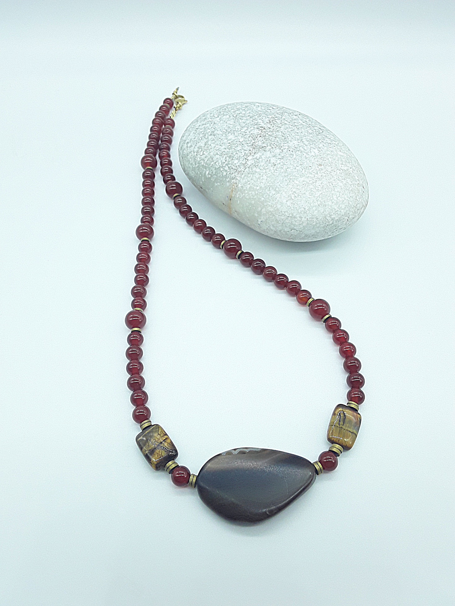 The Ember Grace Necklace by Polmadeva – carnelian, tiger’s eye, and agate necklace symbolizing courage, clarity, and graceful strength