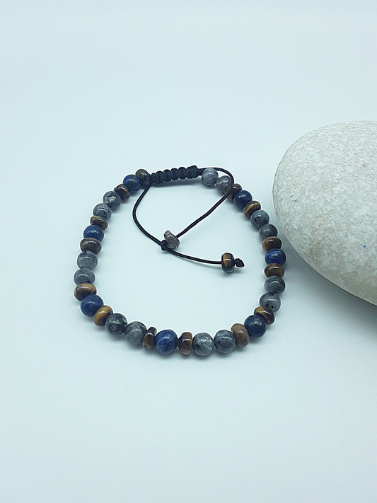The Stone Whisper Bracelet by Polmadeva – handcrafted with Labradorite, Lapis Lazuli & Tiger’s Eye (6 mm). Adjustable 18–24 cm. A talisman of grounding, wisdom & quiet strength.