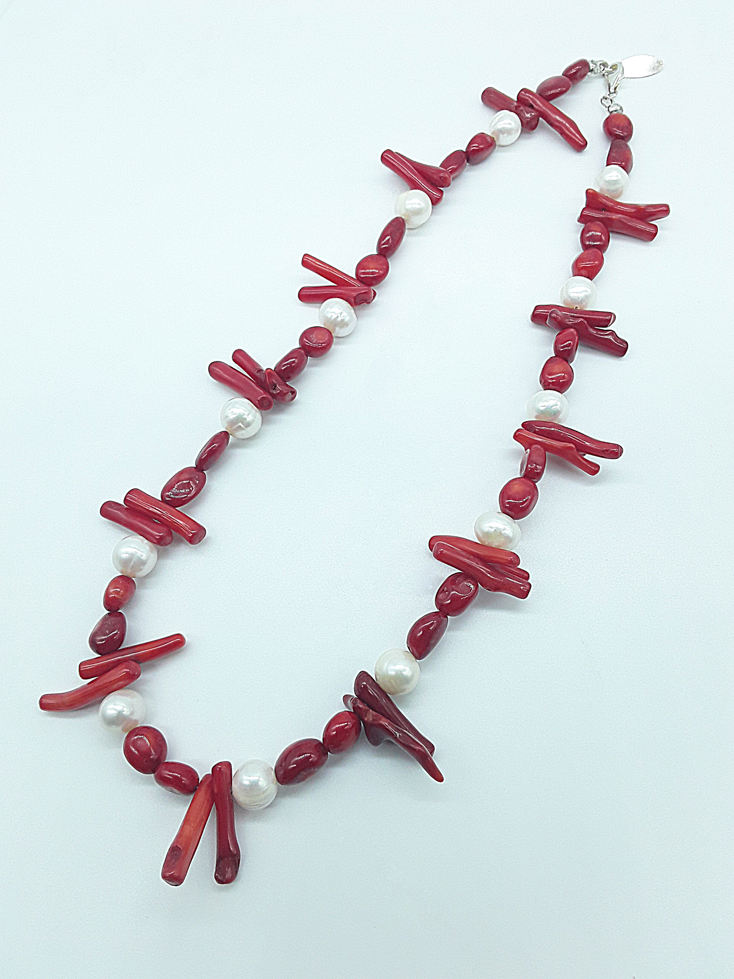 The Coral Grace Necklace by Polmadeva – red coral and freshwater pearl necklace symbolizing passion, serenity, and elegant strength