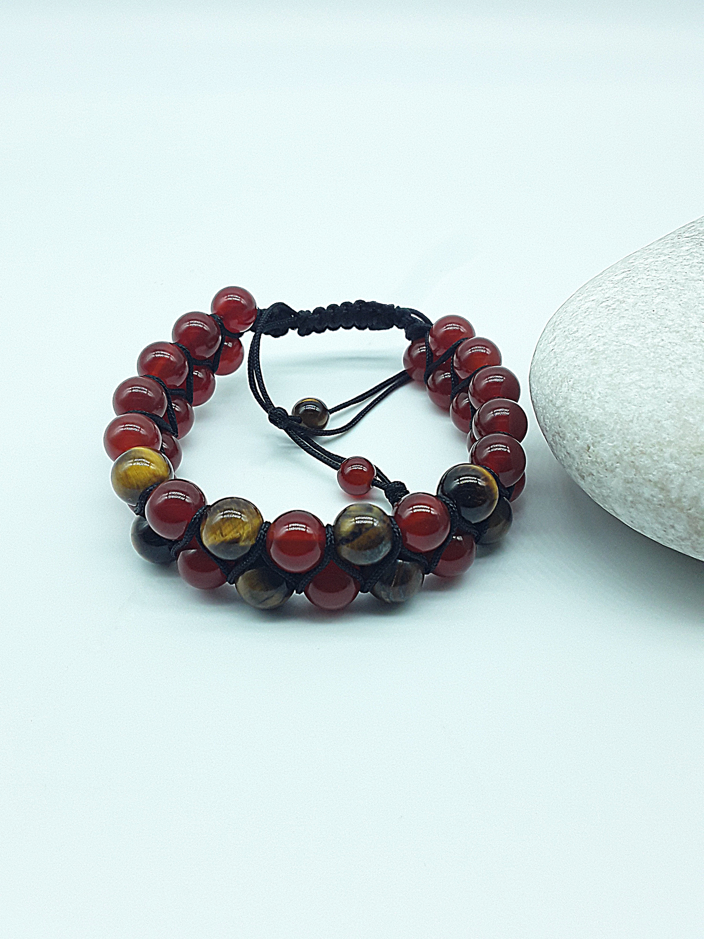 The Flame & Stone Double Bracelet by Polmadeva – carnelian and tiger’s eye double-strand bracelet symbolizing courage, focus, and strength