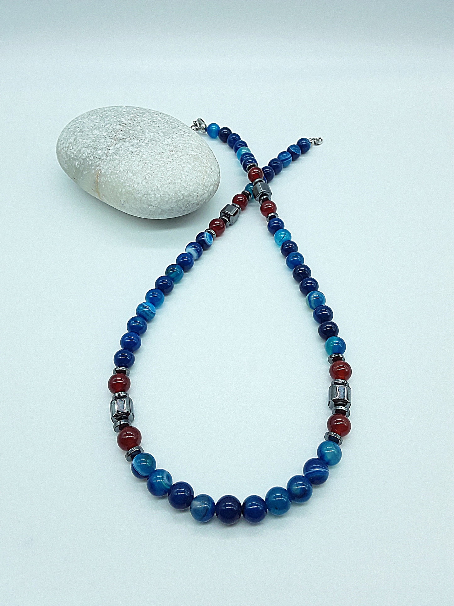 The Warrior’s Arc Necklace by Polmadeva – agate, carnelian and hematite necklace symbolizing courage, grounding, and fearless strength