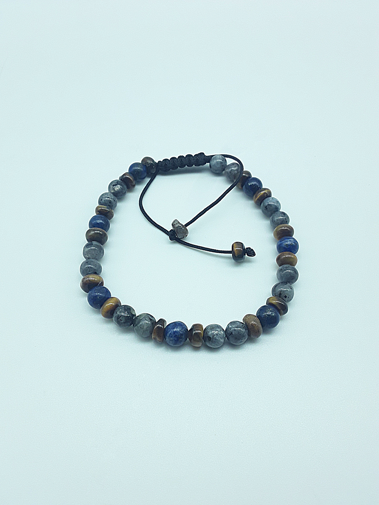 The Stone Whisper Bracelet by Polmadeva – handcrafted with Labradorite, Lapis Lazuli & Tiger’s Eye (6 mm). Adjustable 18–24 cm. A talisman of grounding, wisdom & quiet strength.
