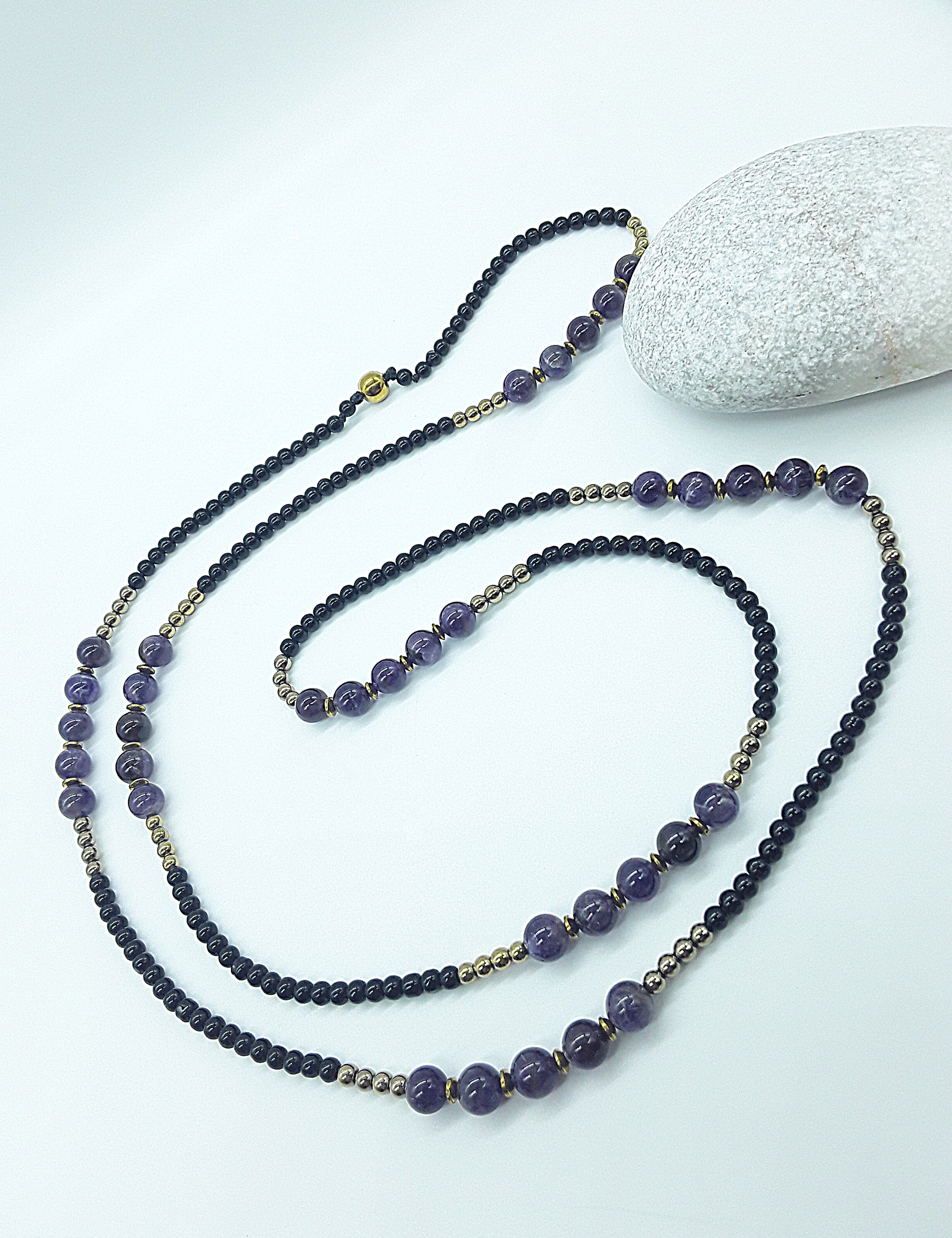 The Graceful Flow Necklace by Polmadeva – amethyst, black onyx and hematite necklace symbolizing calm strength, balance, and resilience