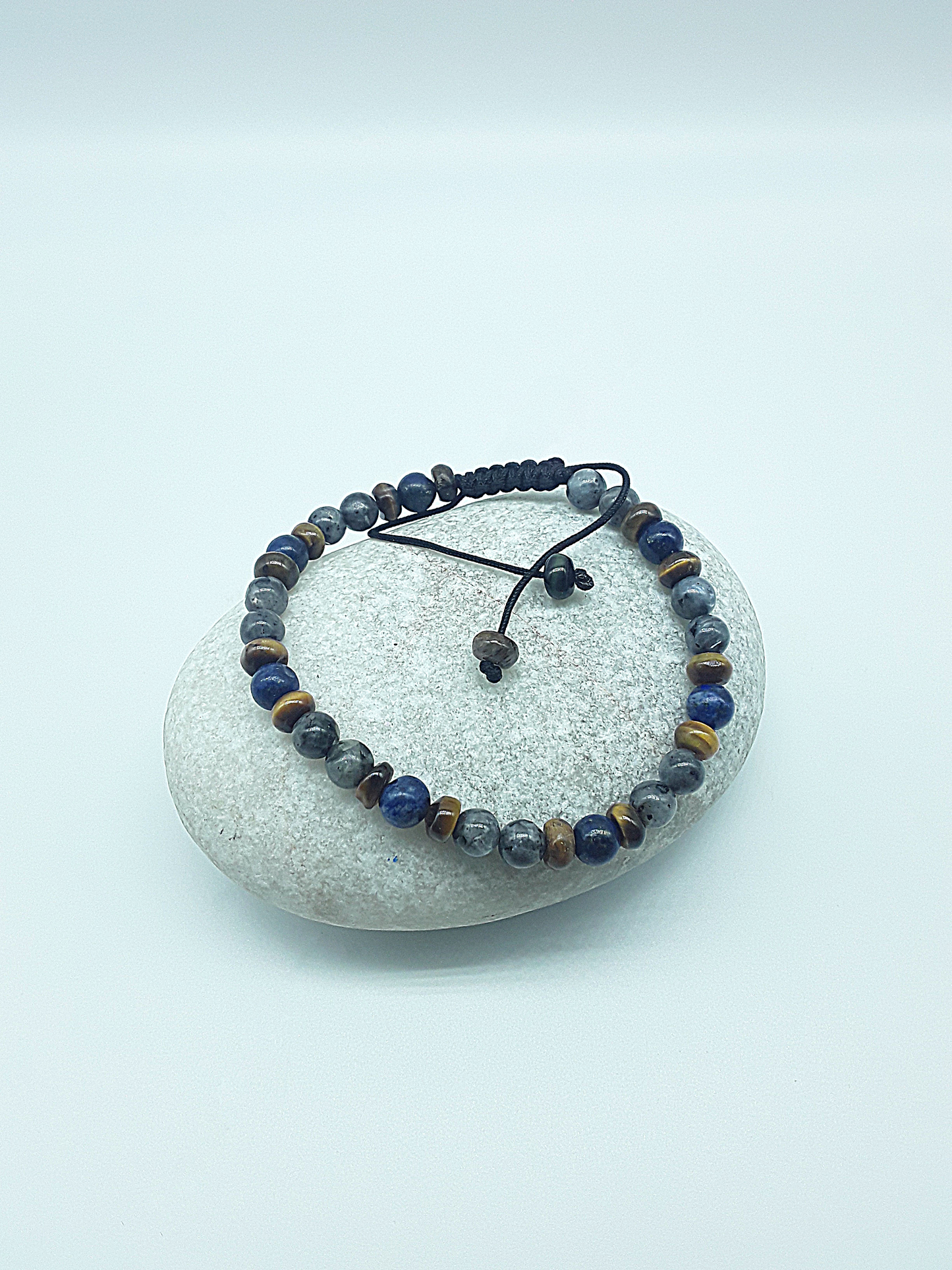 The Stone Whisper Bracelet by Polmadeva – handcrafted with Labradorite, Lapis Lazuli & Tiger’s Eye (6 mm). Adjustable 18–24 cm. A talisman of grounding, wisdom & quiet strength.