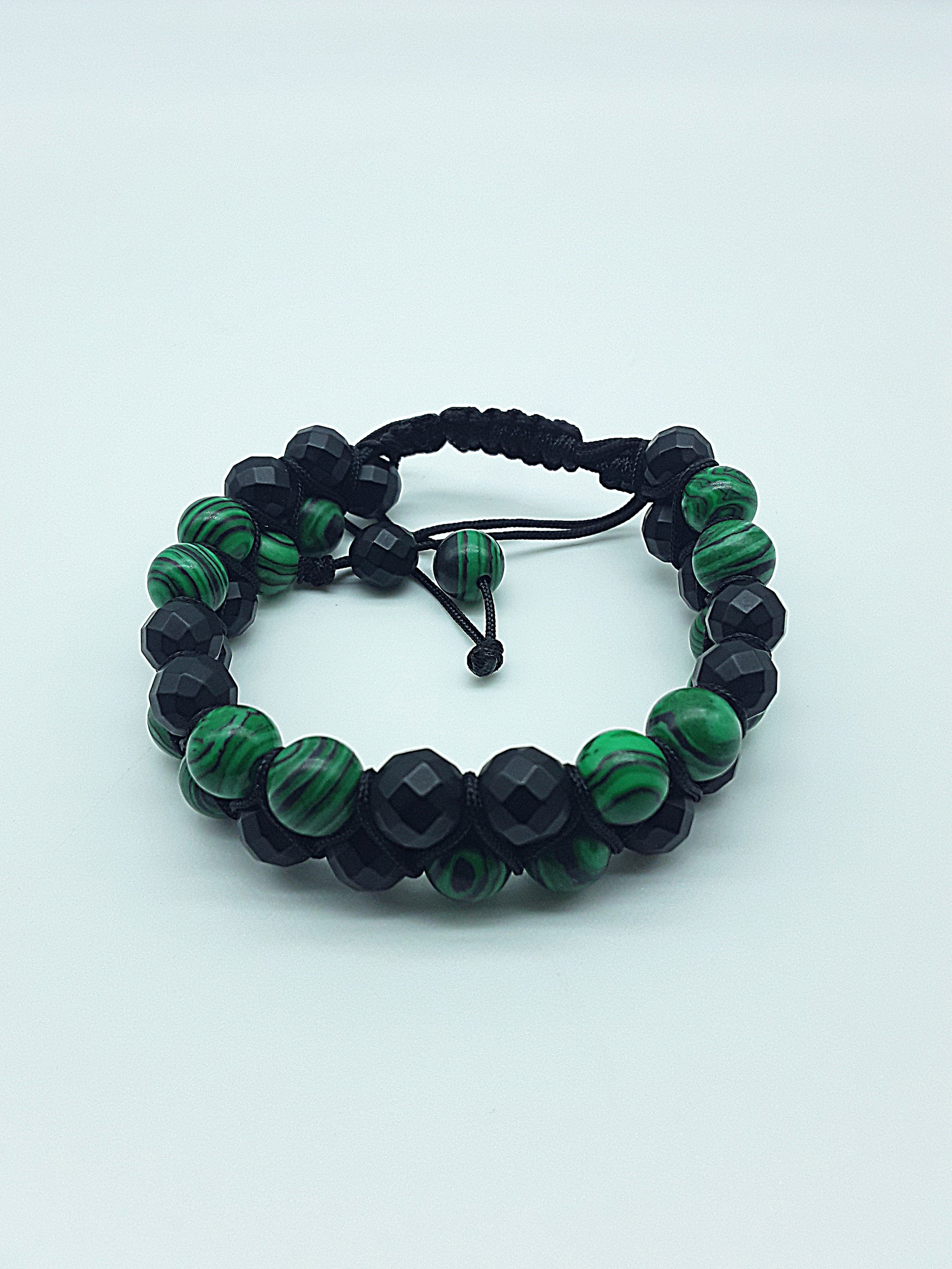 The Emerald Shadow Double Bracelet by Polmadeva – malachite and black onyx double bracelet symbolizing growth, grounding, and balanced strength
