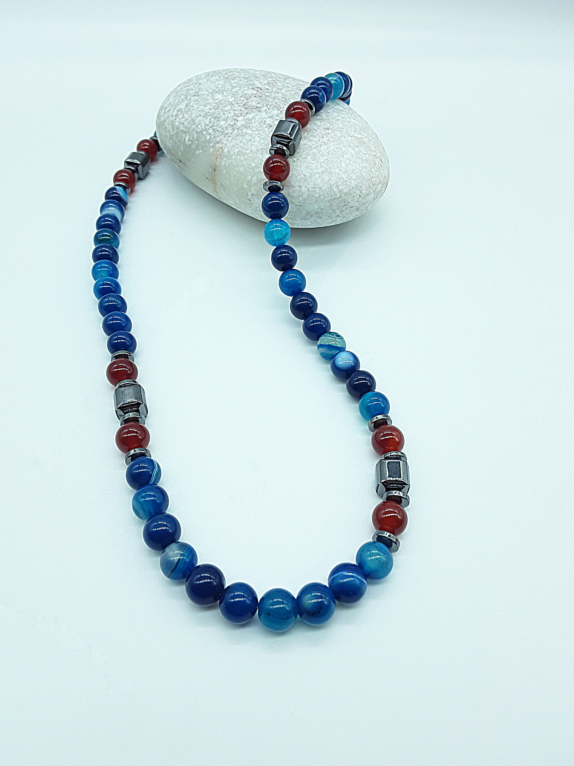 The Warrior’s Arc Necklace by Polmadeva – agate, carnelian and hematite necklace symbolizing courage, grounding, and fearless strength