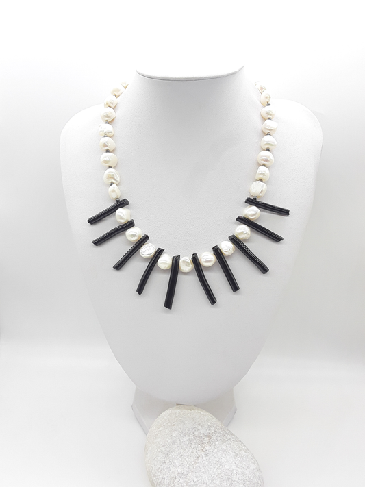 The Tidesong Necklace by Polmadeva – freshwater pearl, black coral and 925 silver necklace symbolizing elegance, strength, and balance