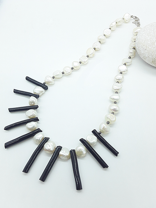 The Tidesong Necklace by Polmadeva – freshwater pearl, black coral and 925 silver necklace symbolizing elegance, strength, and balance