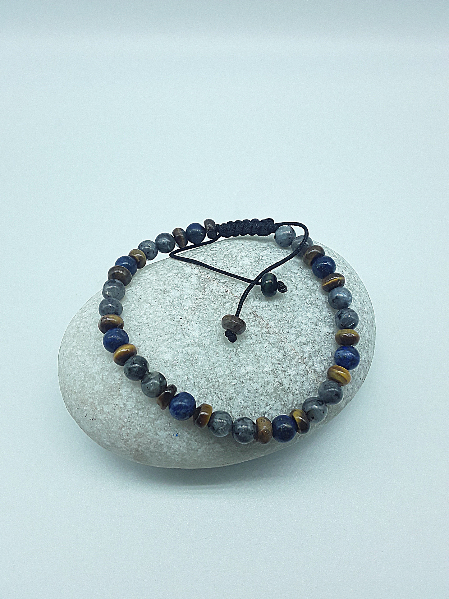 The Stone Whisper Bracelet by Polmadeva – handcrafted with Labradorite, Lapis Lazuli & Tiger’s Eye (6 mm). Adjustable 18–24 cm. A talisman of grounding, wisdom & quiet strength.