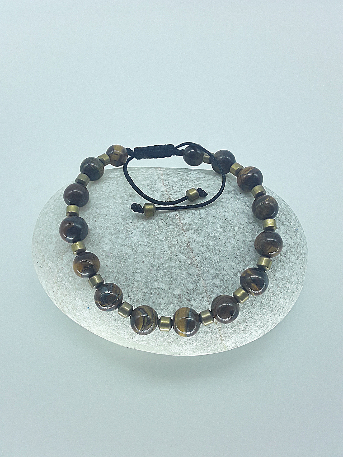 The Emberheart Bracelet by Polmadeva – tiger eye and hematite adjustable bracelet symbolizing courage, balance, and resilience