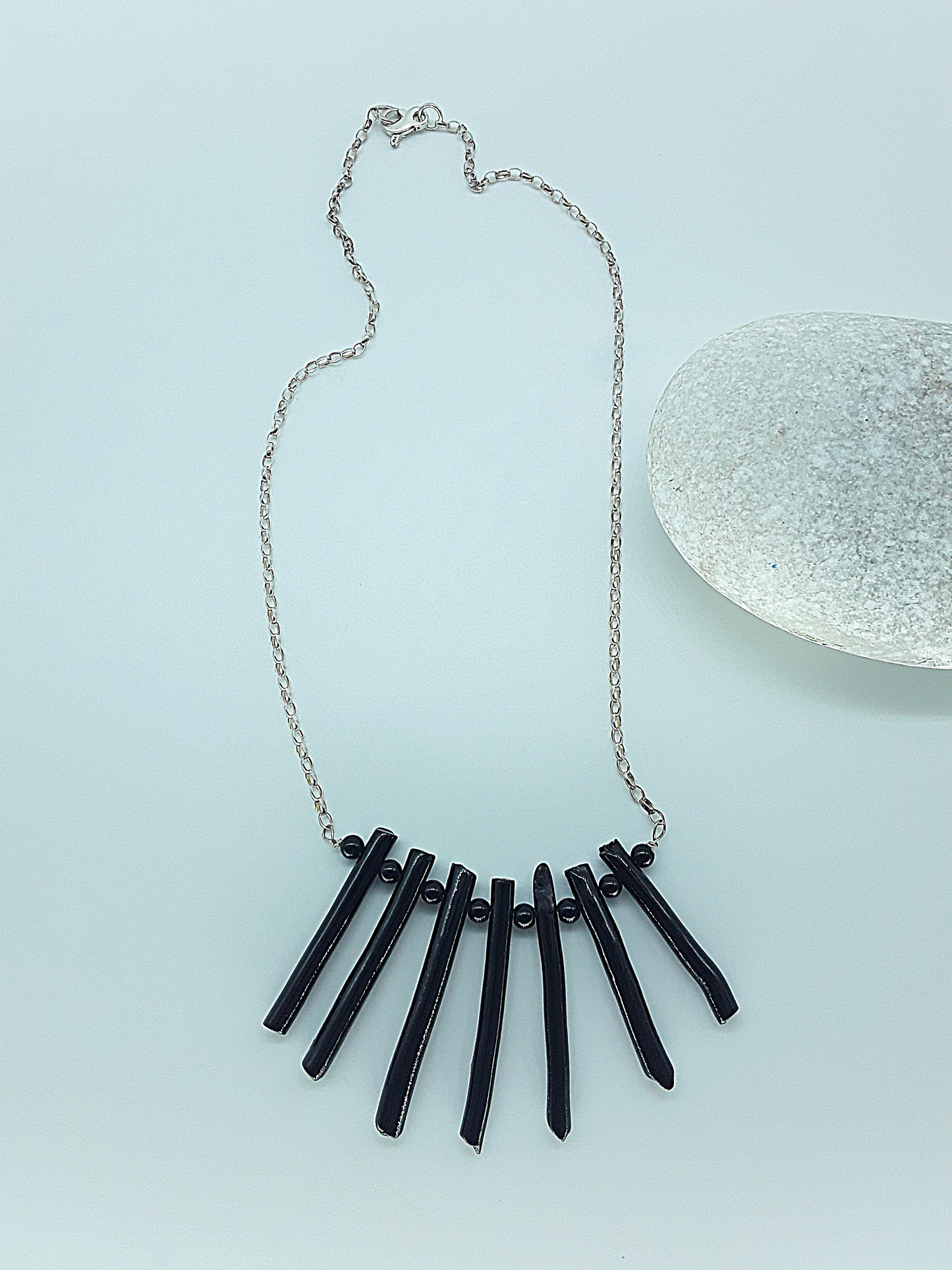 The Black Fang Necklace by Polmadeva – black coral and 925 silver necklace symbolizing protection, grounding, and timeless strength