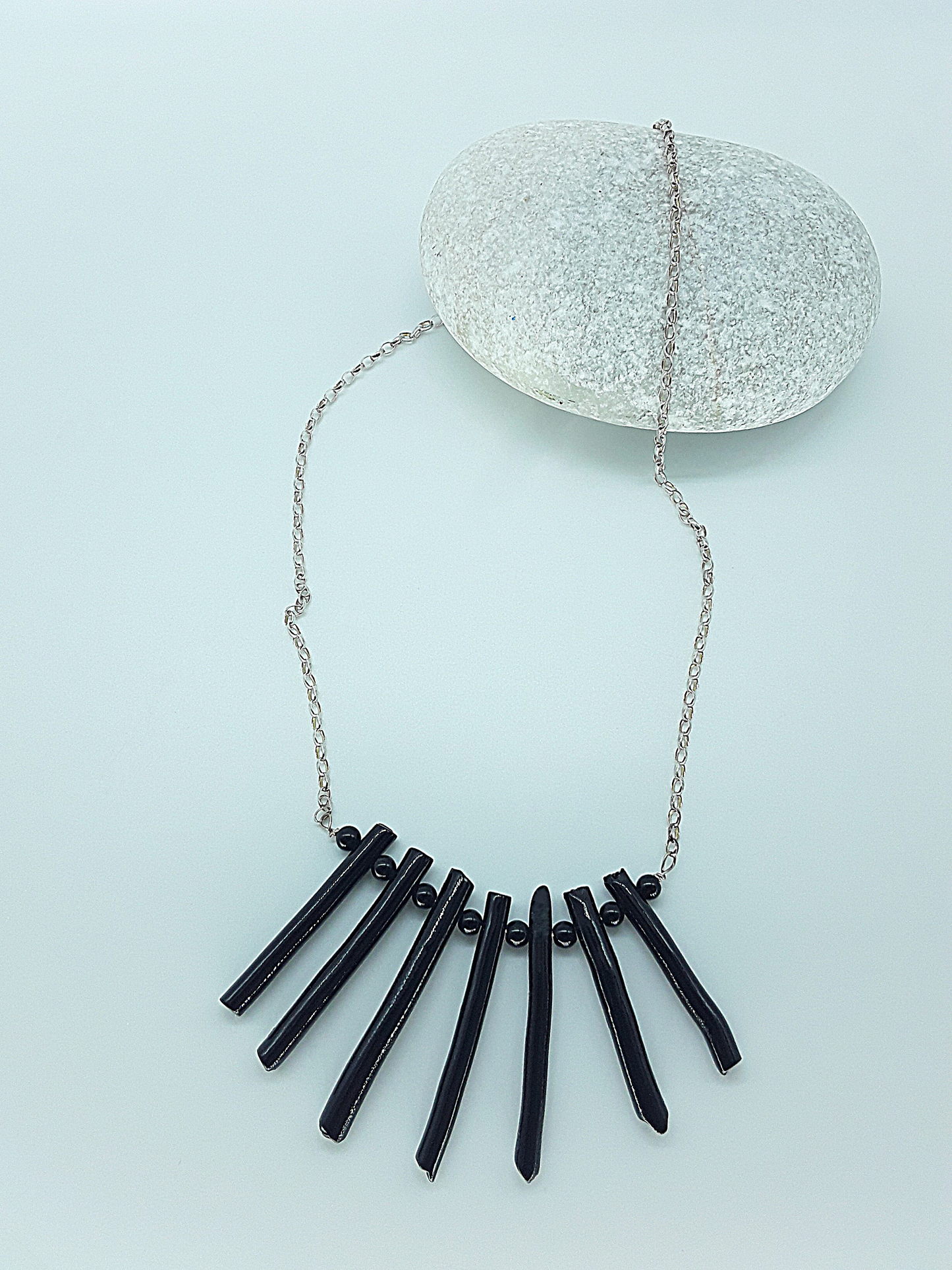 The Black Fang Necklace by Polmadeva – black coral and 925 silver necklace symbolizing protection, grounding, and timeless strength