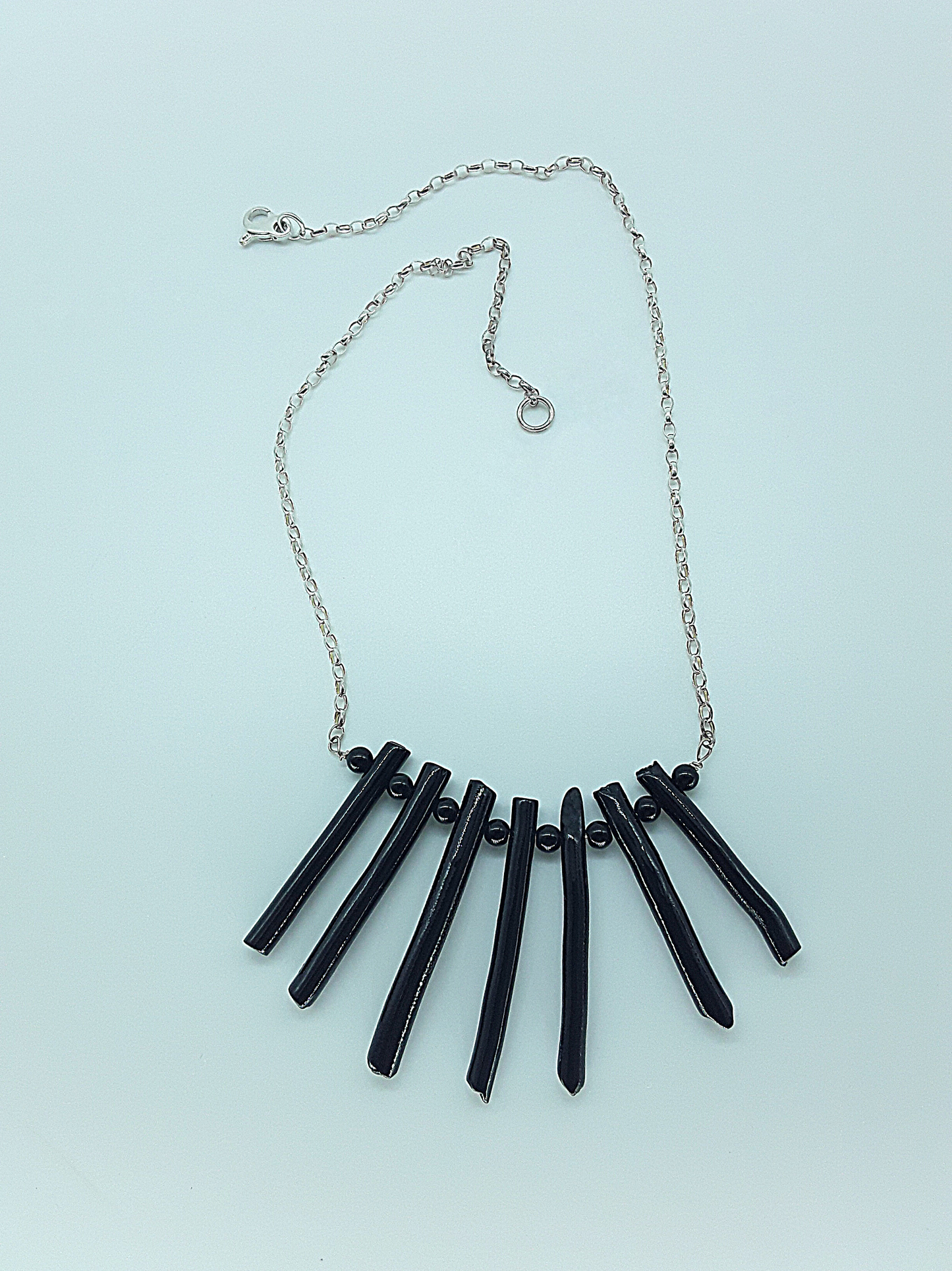 The Black Fang Necklace by Polmadeva – black coral and 925 silver necklace symbolizing protection, grounding, and timeless strength