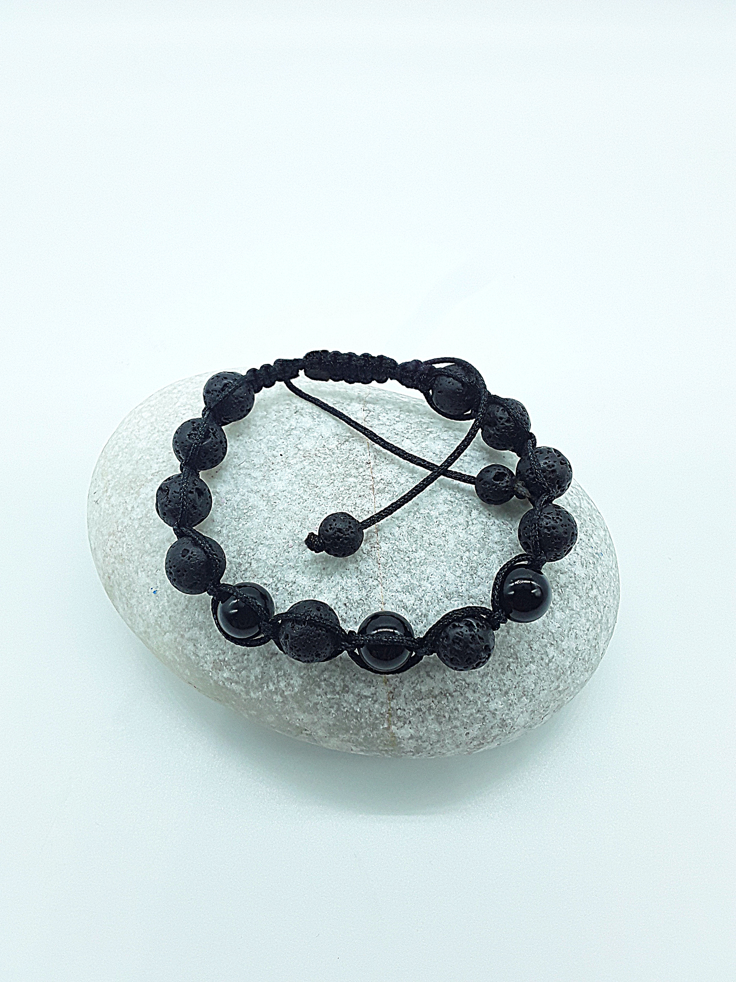 The Phoenix Stone Bracelet by Polmadeva – lava stone and onyx bracelet symbolizing renewal, grounding, and new beginnings