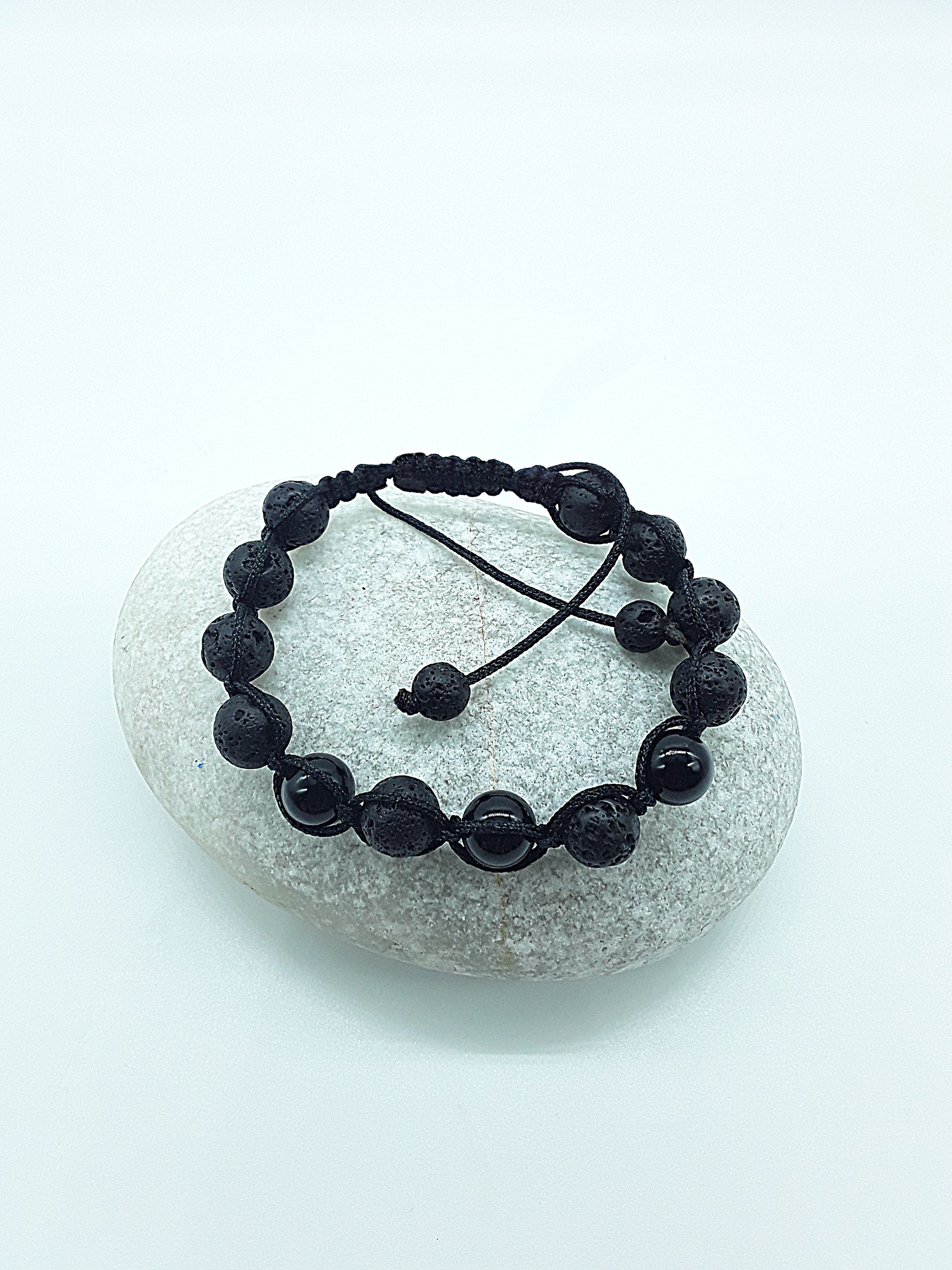 The Phoenix Stone Bracelet by Polmadeva – lava stone and onyx bracelet symbolizing renewal, grounding, and new beginnings