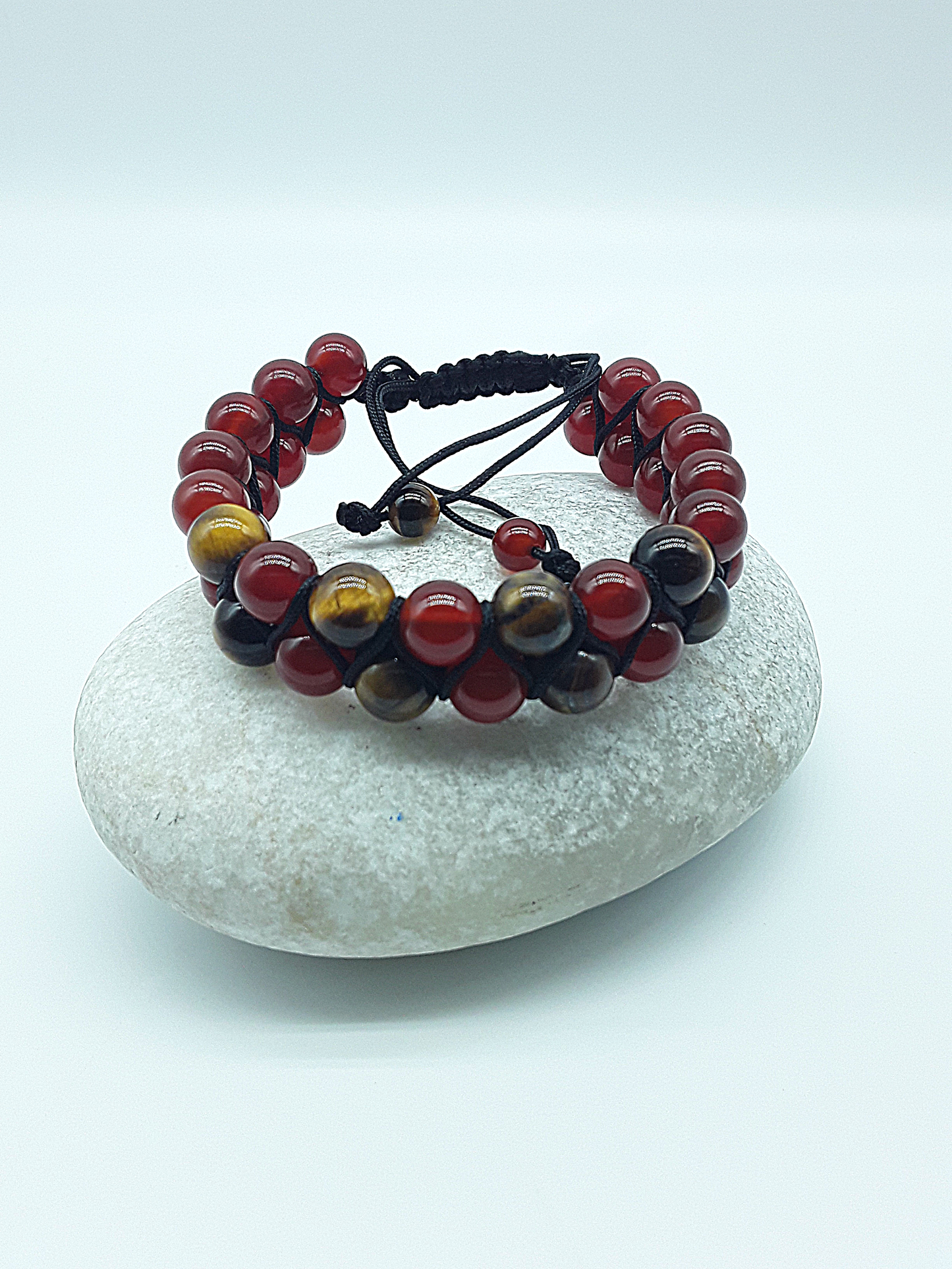 The Flame & Stone Double Bracelet by Polmadeva – carnelian and tiger’s eye double-strand bracelet symbolizing courage, focus, and strength