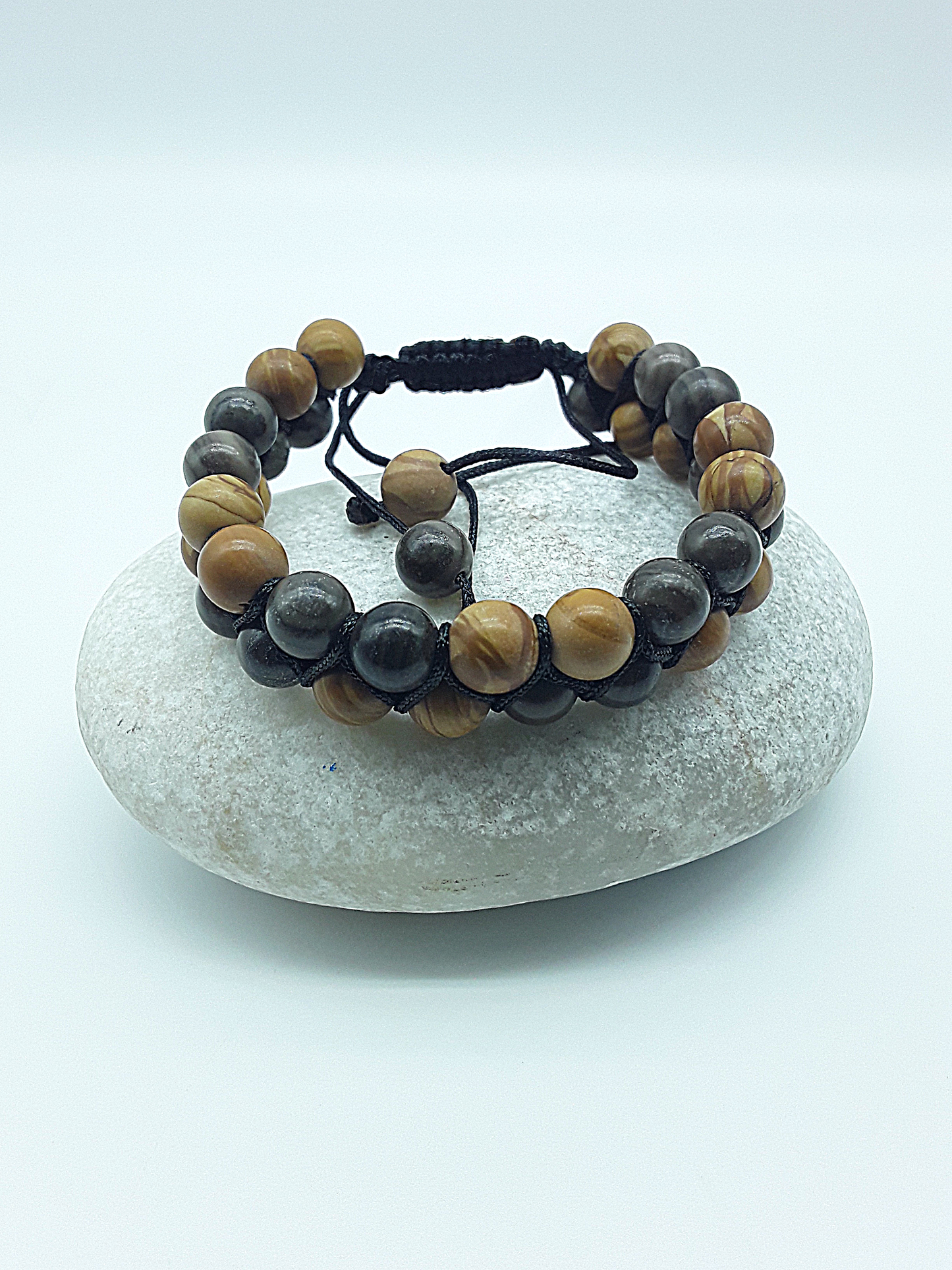 The Earth Harmony Double Bracelet by Polmadeva – Black Wood Lace Stone & Tigerskin Jasper bracelet symbolizing grounding, balance, and harmony.