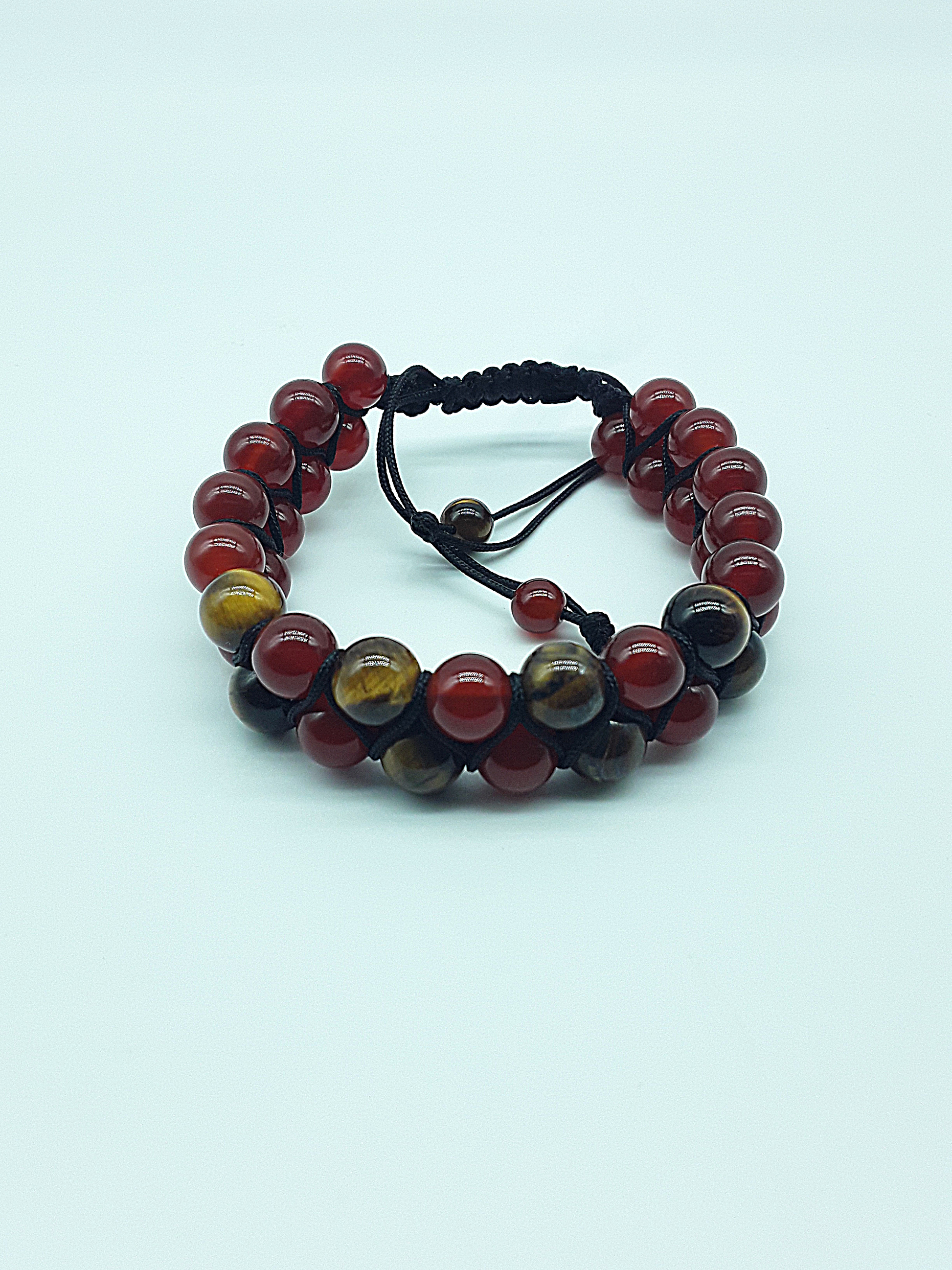 The Flame & Stone Double Bracelet by Polmadeva – carnelian and tiger’s eye double-strand bracelet symbolizing courage, focus, and strength