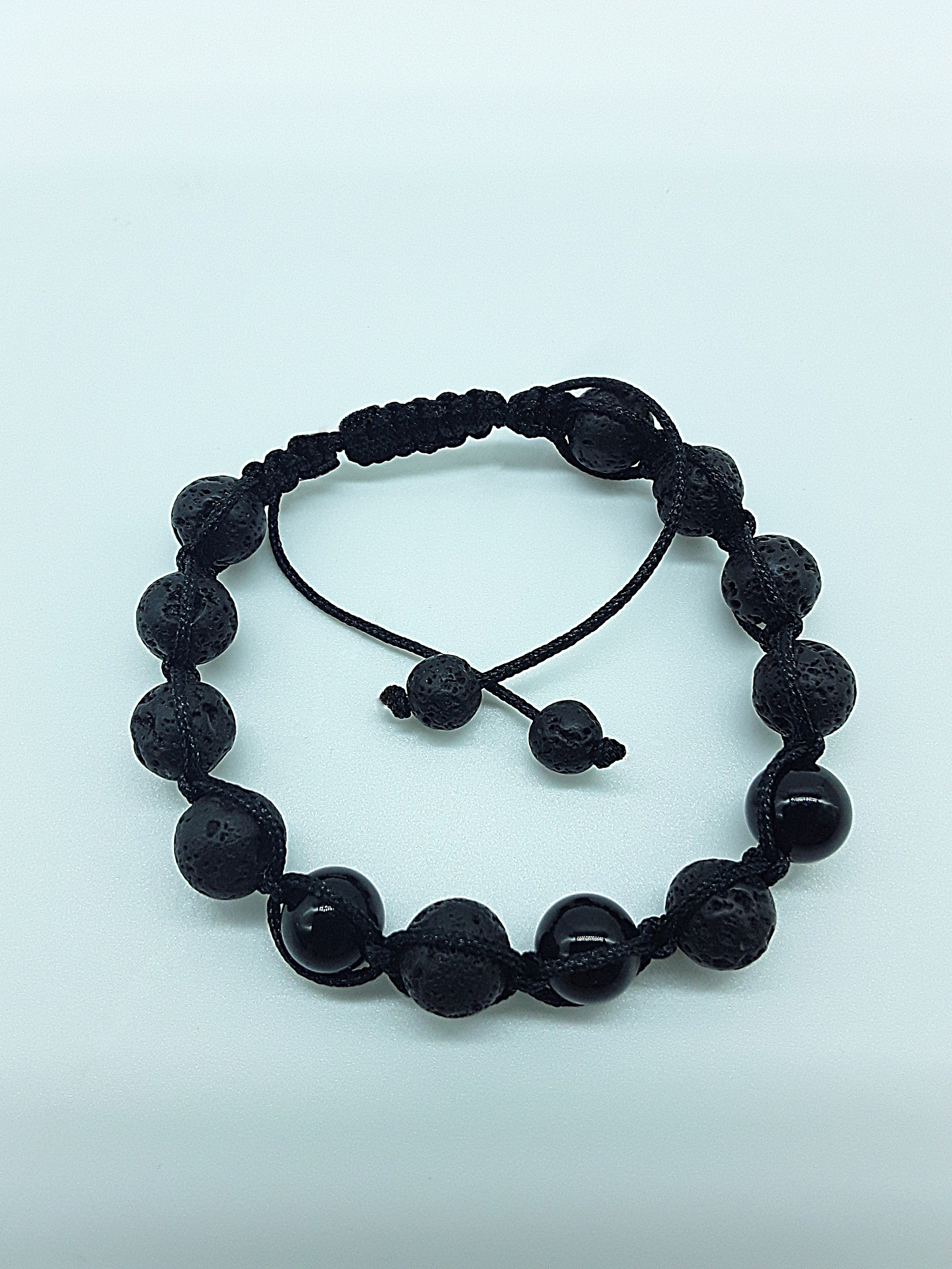 The Phoenix Stone Bracelet by Polmadeva – lava stone and onyx bracelet symbolizing renewal, grounding, and new beginnings