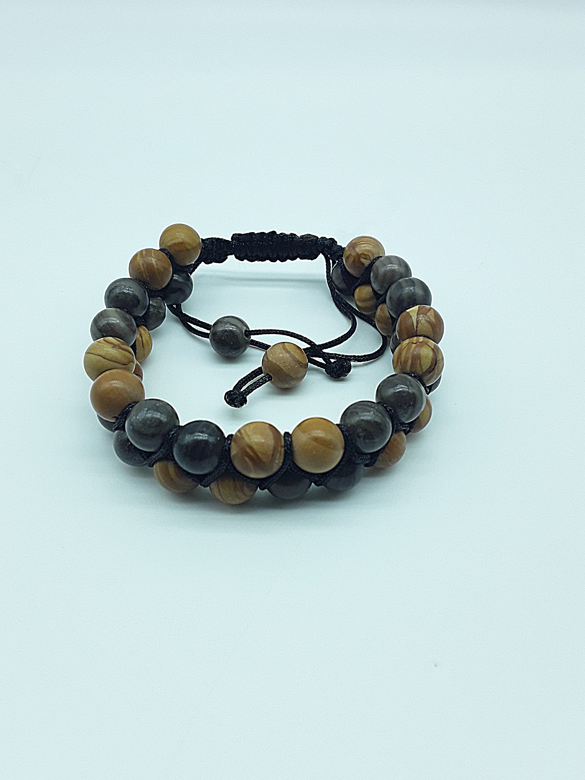 The Earth Harmony Double Bracelet by Polmadeva – Black Wood Lace Stone & Tigerskin Jasper bracelet symbolizing grounding, balance, and harmony.