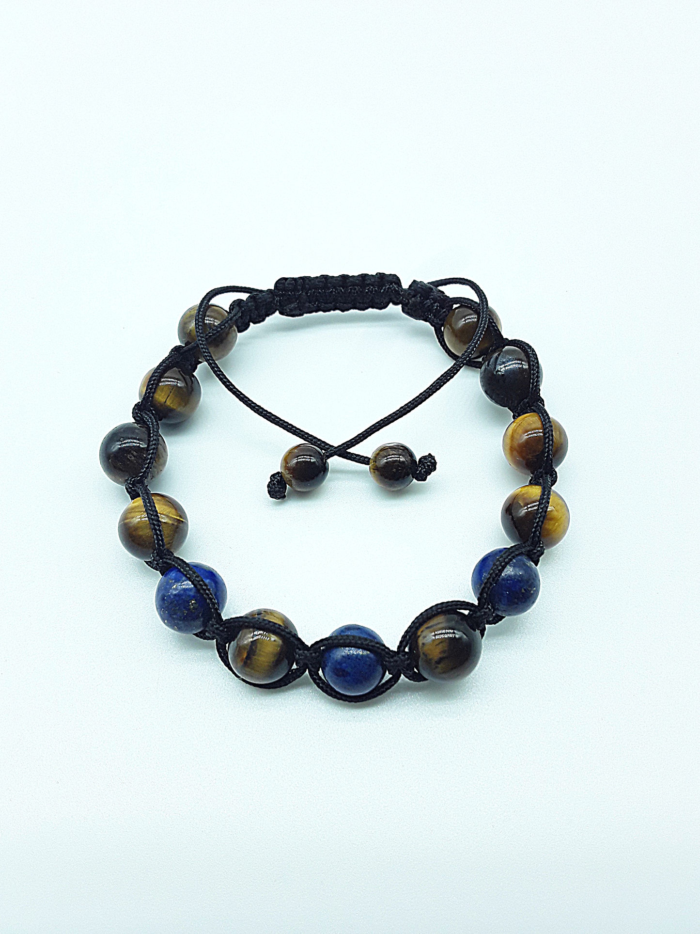 The Seer’s Path Bracelet by Polmadeva – handcrafted bracelet with Lapis Lazuli & Tiger’s Eye (8 mm), adjustable 18–24 cm. A talisman of intuition & grounded vision.