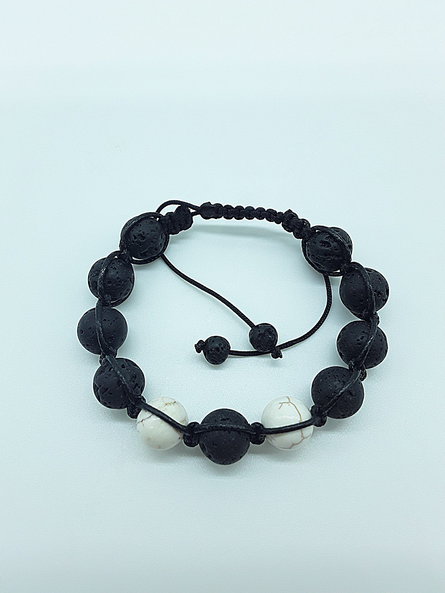 The Silent Guardian Bracelet by Polmadeva – lava stone and magnesite bracelet symbolizing protection, clarity, and resilience