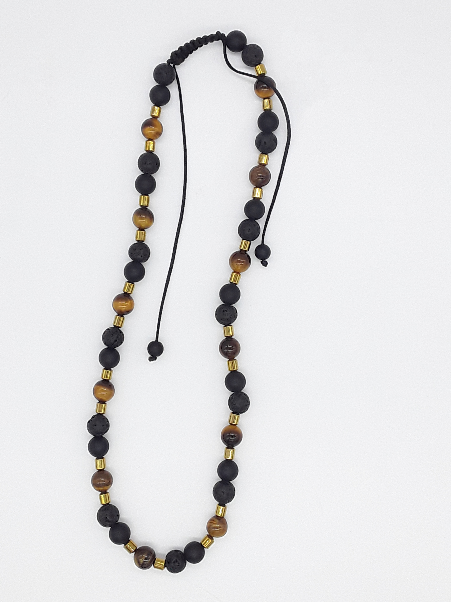 The Fourfold Vision Set by Polmadeva – handcrafted necklace & bracelet with Lava Stone, Tiger’s Eye, Black Onyx & Hematite, symbolizing balance, clarity & endurance.