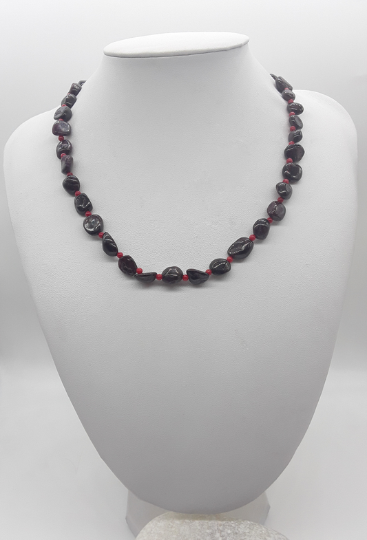 The Crimson Flame Necklace by Polmadeva – garnet and red coral necklace with 925 silver symbolizing courage, resilience, and timeless elegance