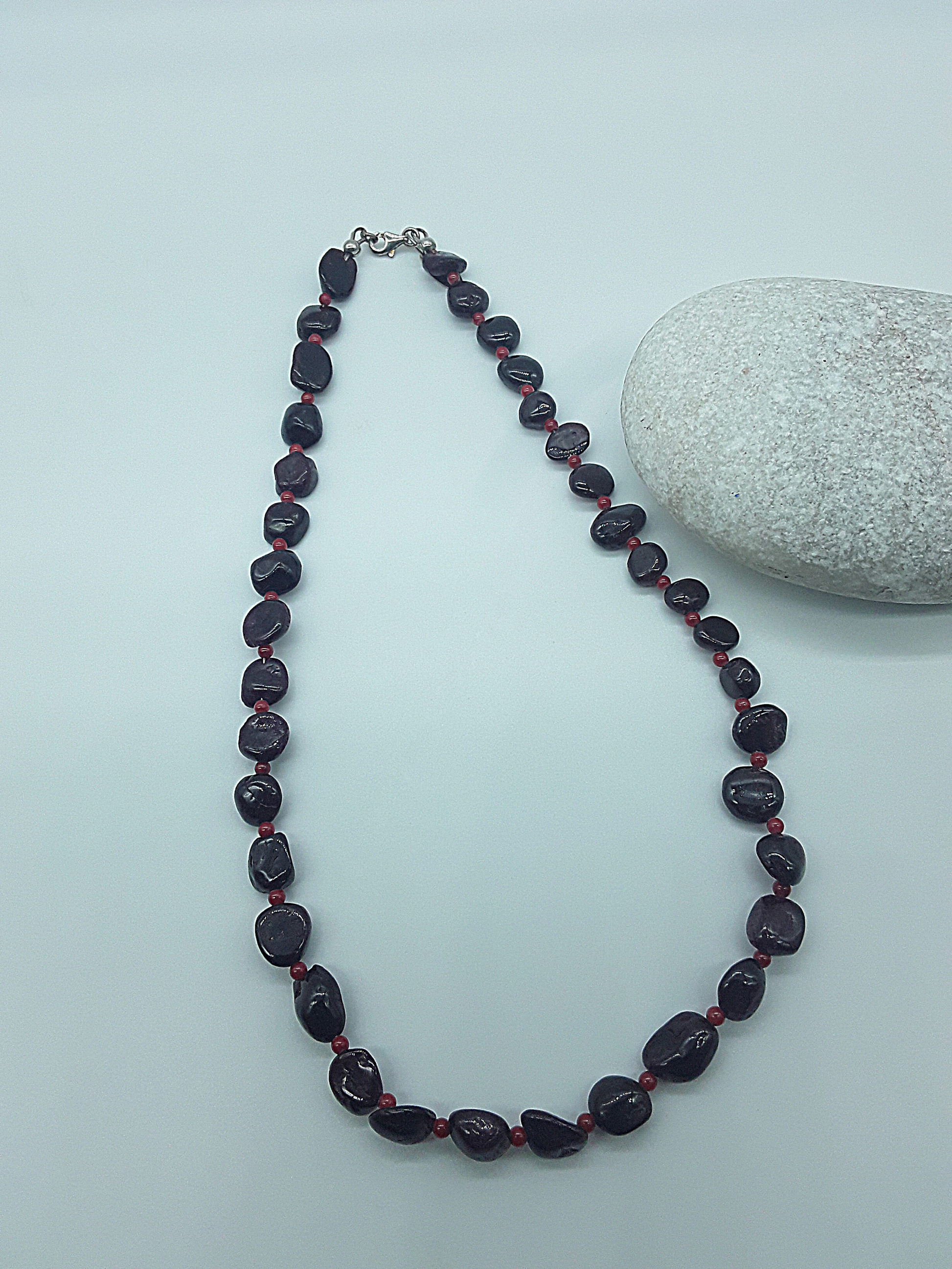 The Crimson Flame Necklace by Polmadeva – garnet and red coral necklace with 925 silver symbolizing courage, resilience, and timeless elegance